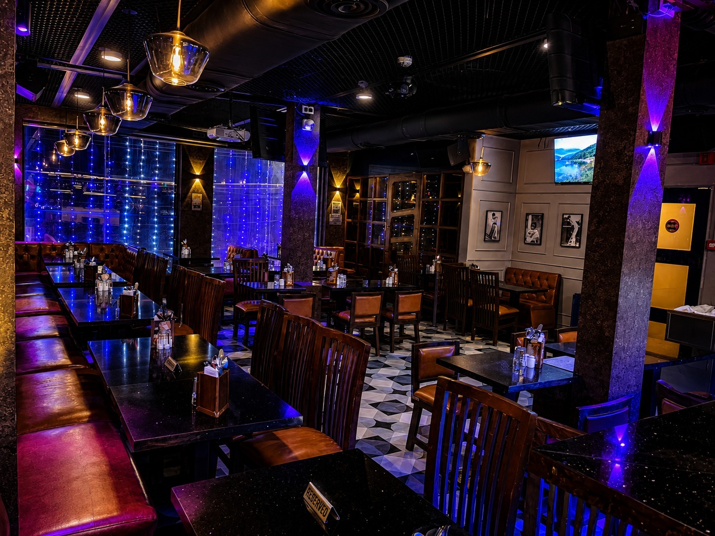 Big Bull Cafe lounge captured during peak night hour with guests seated in Andheri East Mumbai